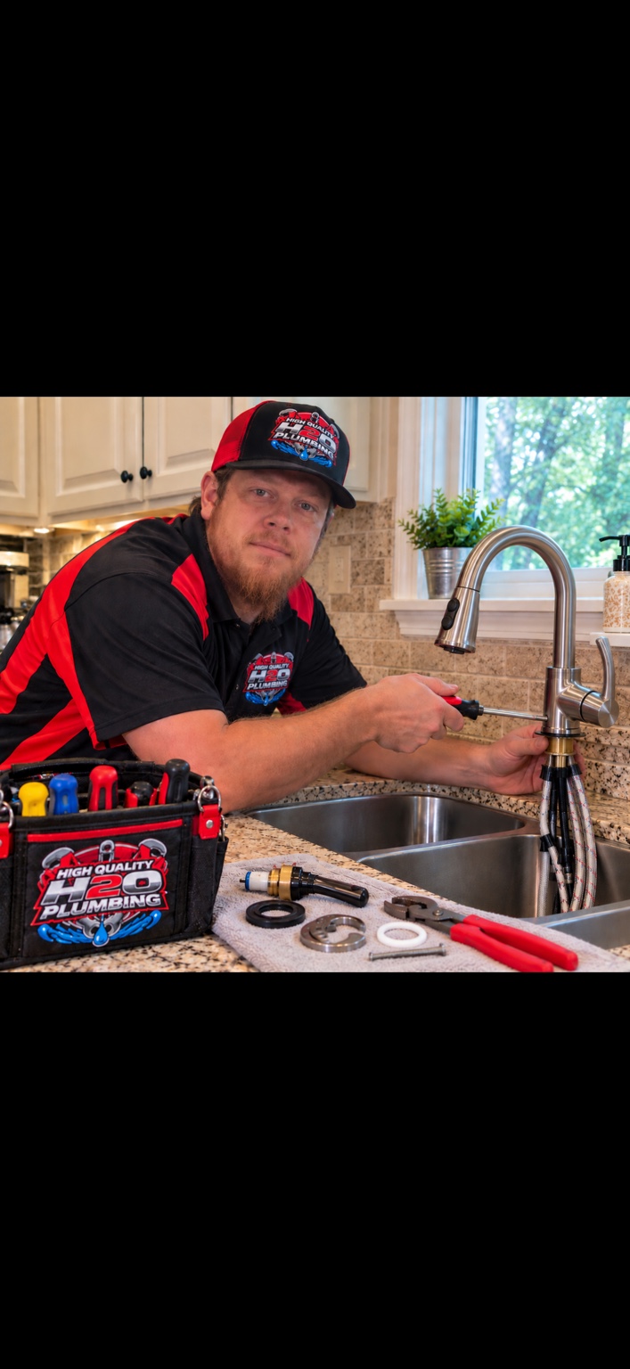 High Quality H2O plumber working on a kitchen faucet